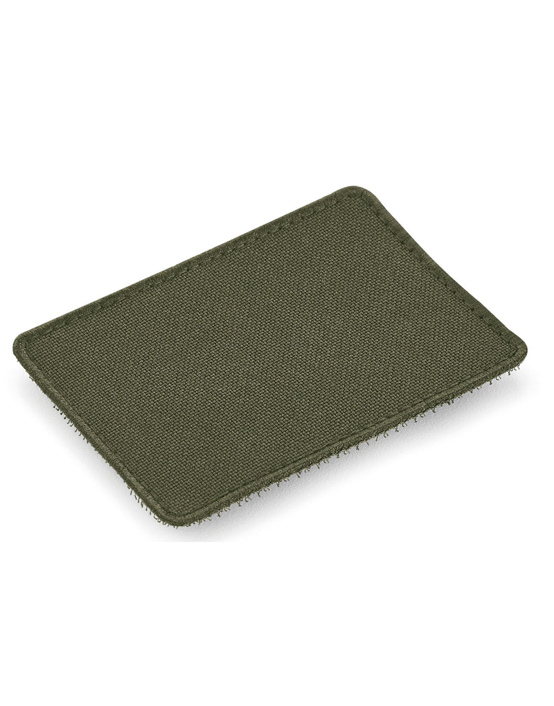 Angled view of the soft green Bagbase boutique waist bag showing its texture.