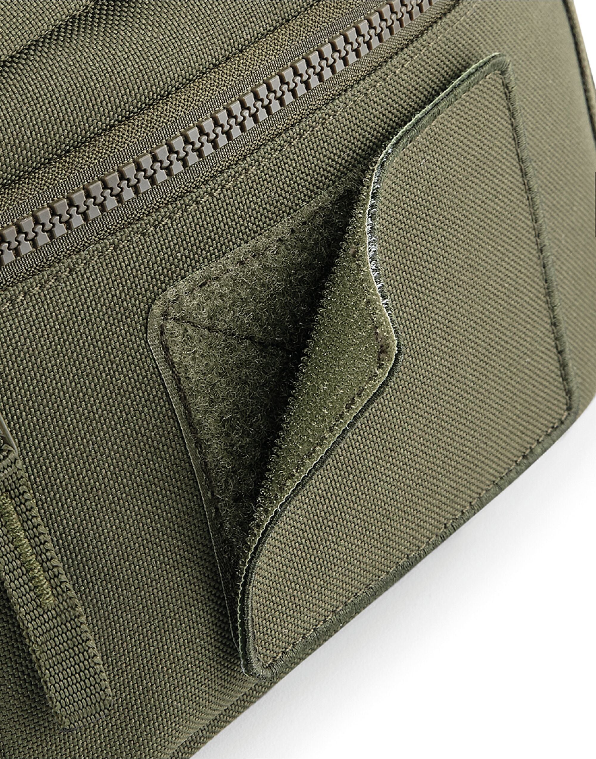 A person holding the soft green matte PU keyring.