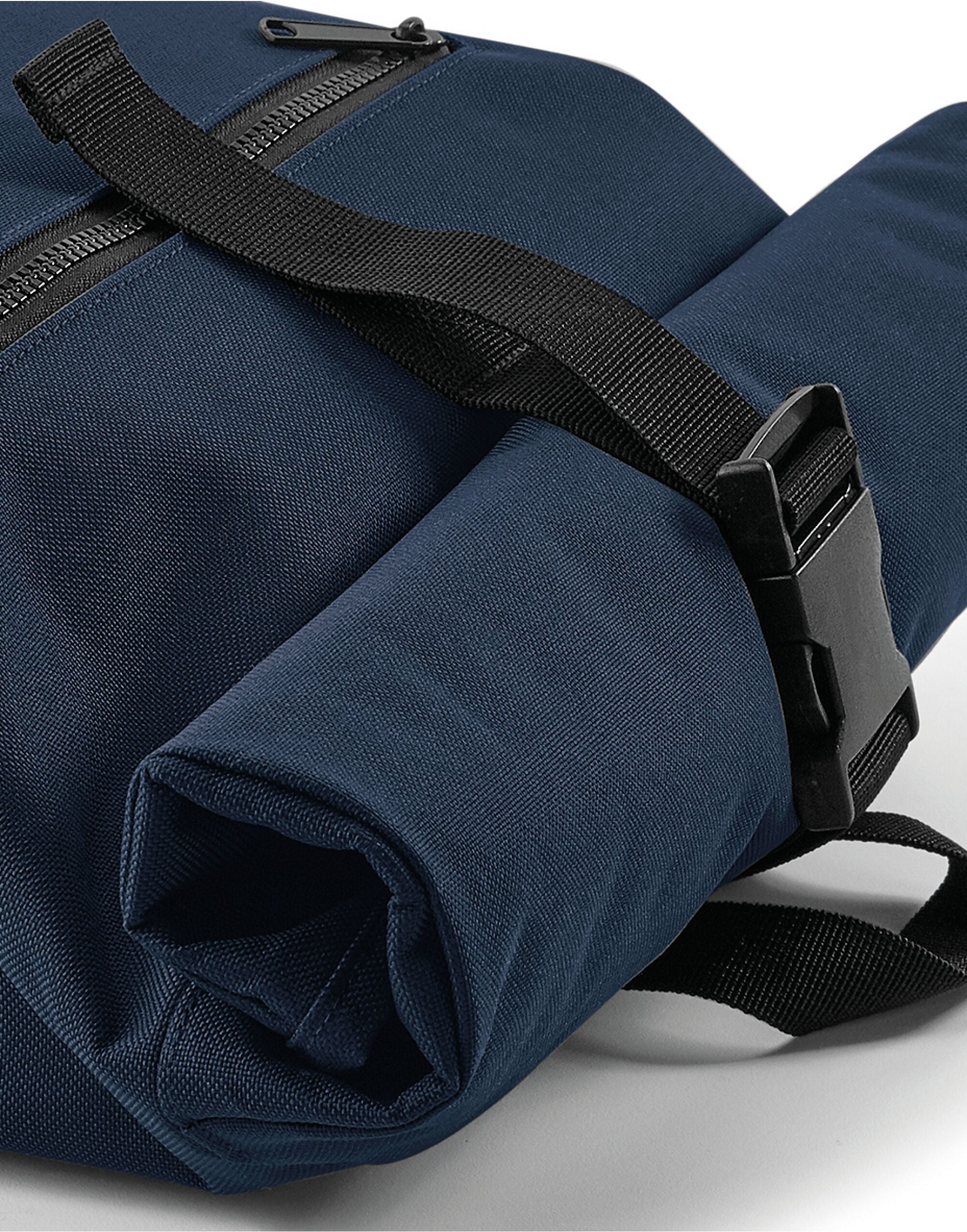 Action shot of the Bagbase Roll-Top Backpack, perfect for cycling and urban exploration.