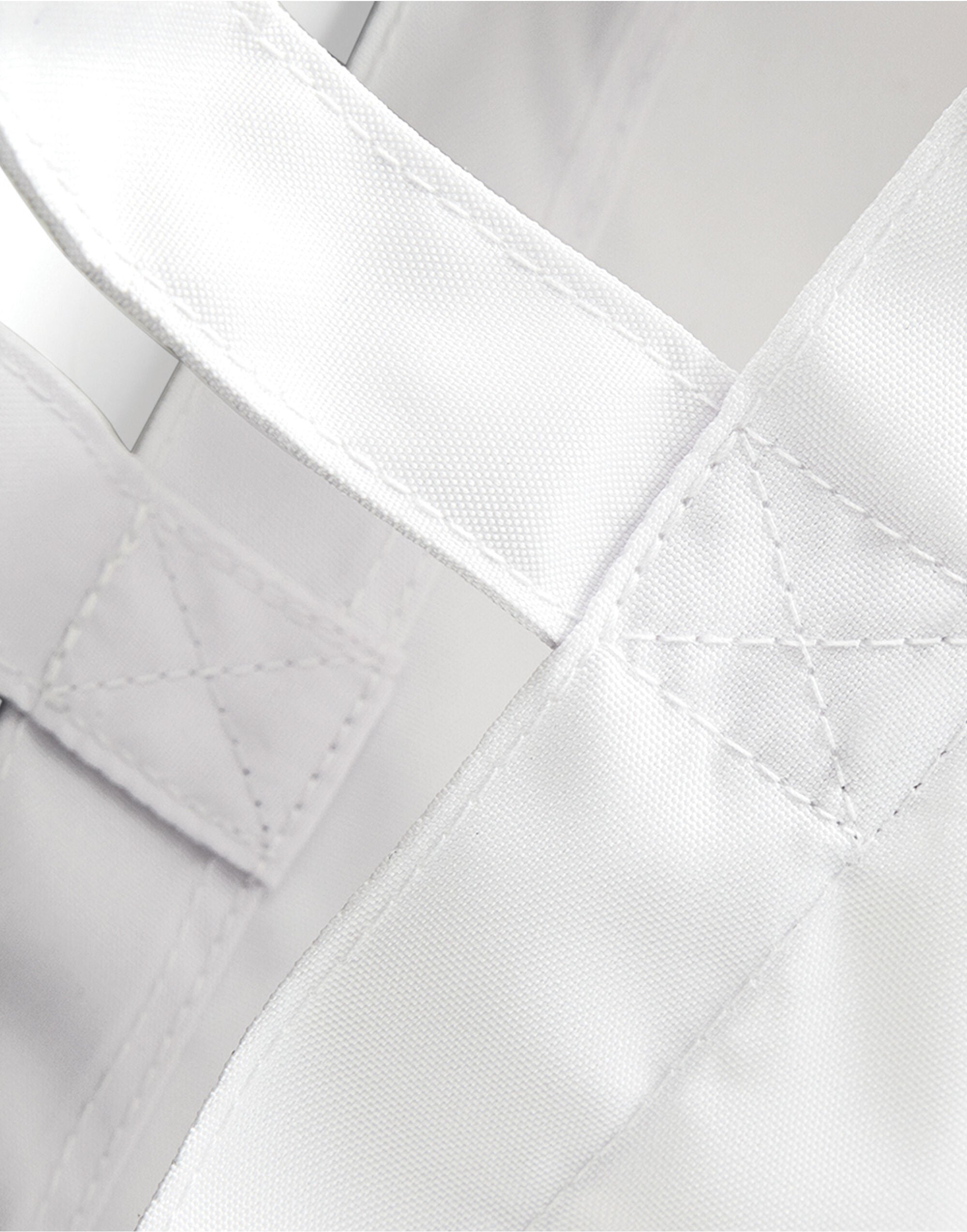 Close-up on the polyester sublimation panel of the Bagbase Shopper, ensuring a vibrant and clear print.