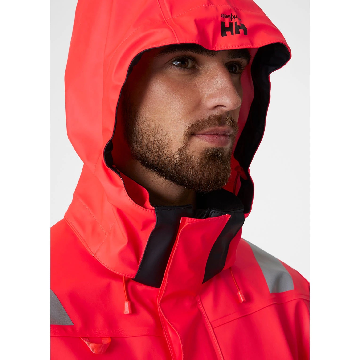man wearing Helly Hansen Alna 2.0 Waterproof Rain Jacket - faceview