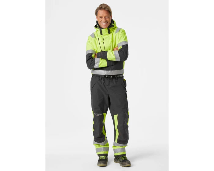 man wearing Helly Hansen Alna 2.0 Hi-Vis Waterproof Rainsuit Coverall