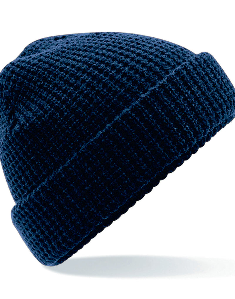 French navy Beechfield B422 cable knit melange beanie with a ribbed cuff.