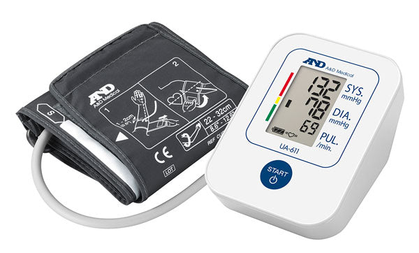 Digital blood pressure monitor with cuff and LCD display showing systolic, diastolic, and pulse rate.