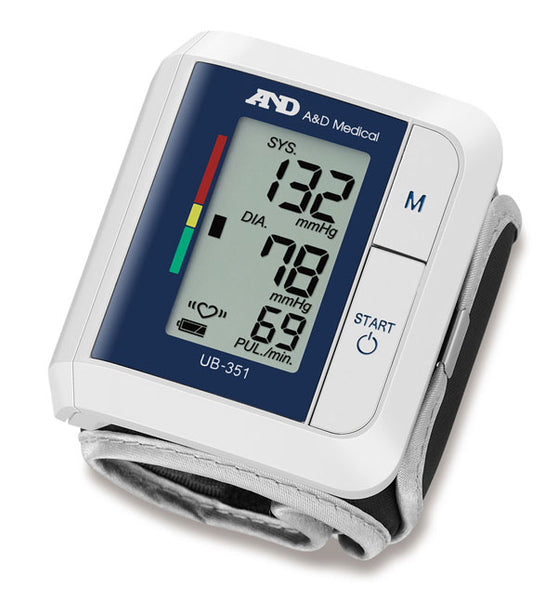Wrist digital blood pressure monitor with LCD screen displaying systolic, diastolic, and pulse readings.