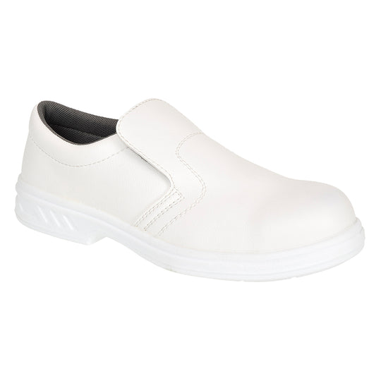 White occupational slip-on shoe with smooth upper and slip-resistant sole for hygiene-critical areas.